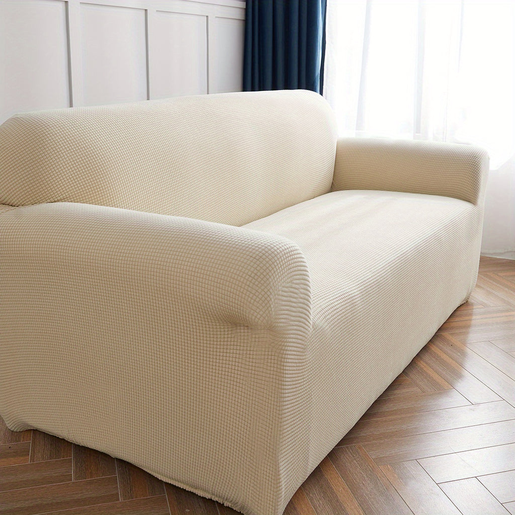 Calma sofa cover in Beige Yellow, closer view of the seat, arm and back