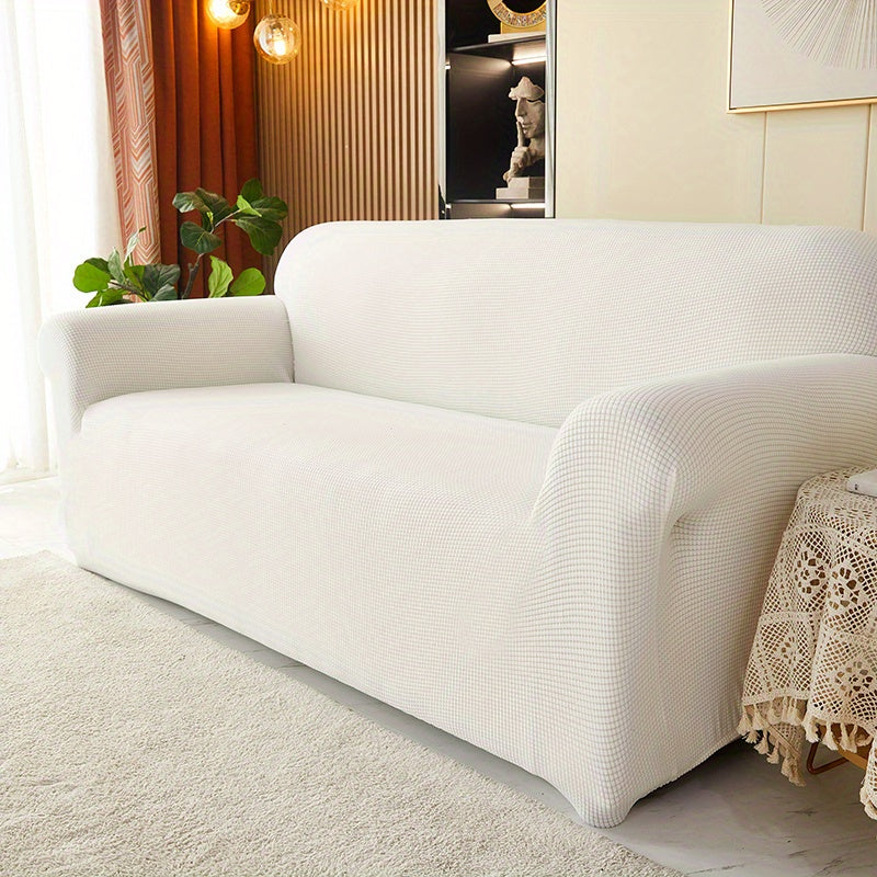 Calma sofa cover in White, angled view of the fitted shape
