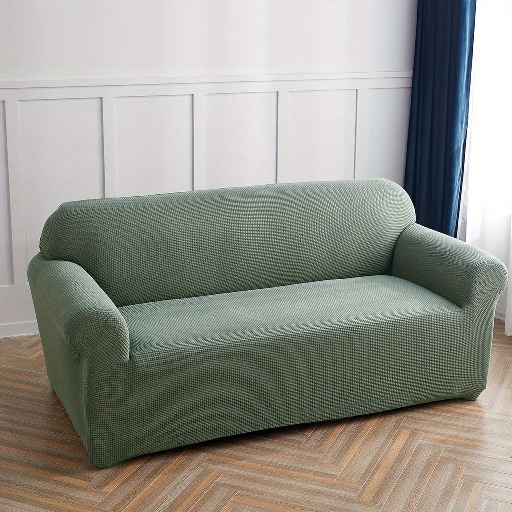 Calma sofa cover in Blackish Green, wide view over the seat and arms