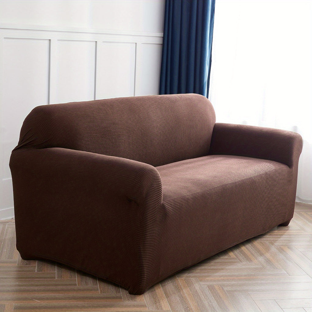 Calma sofa cover in Dark Coffee, angled view of the fitted shape