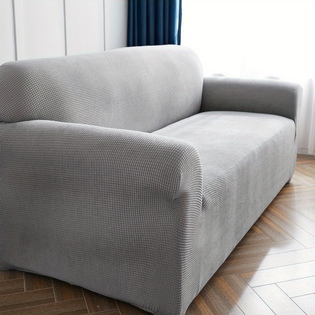 Calma sofa cover in Light Gray, closer view of the seat, arm and back