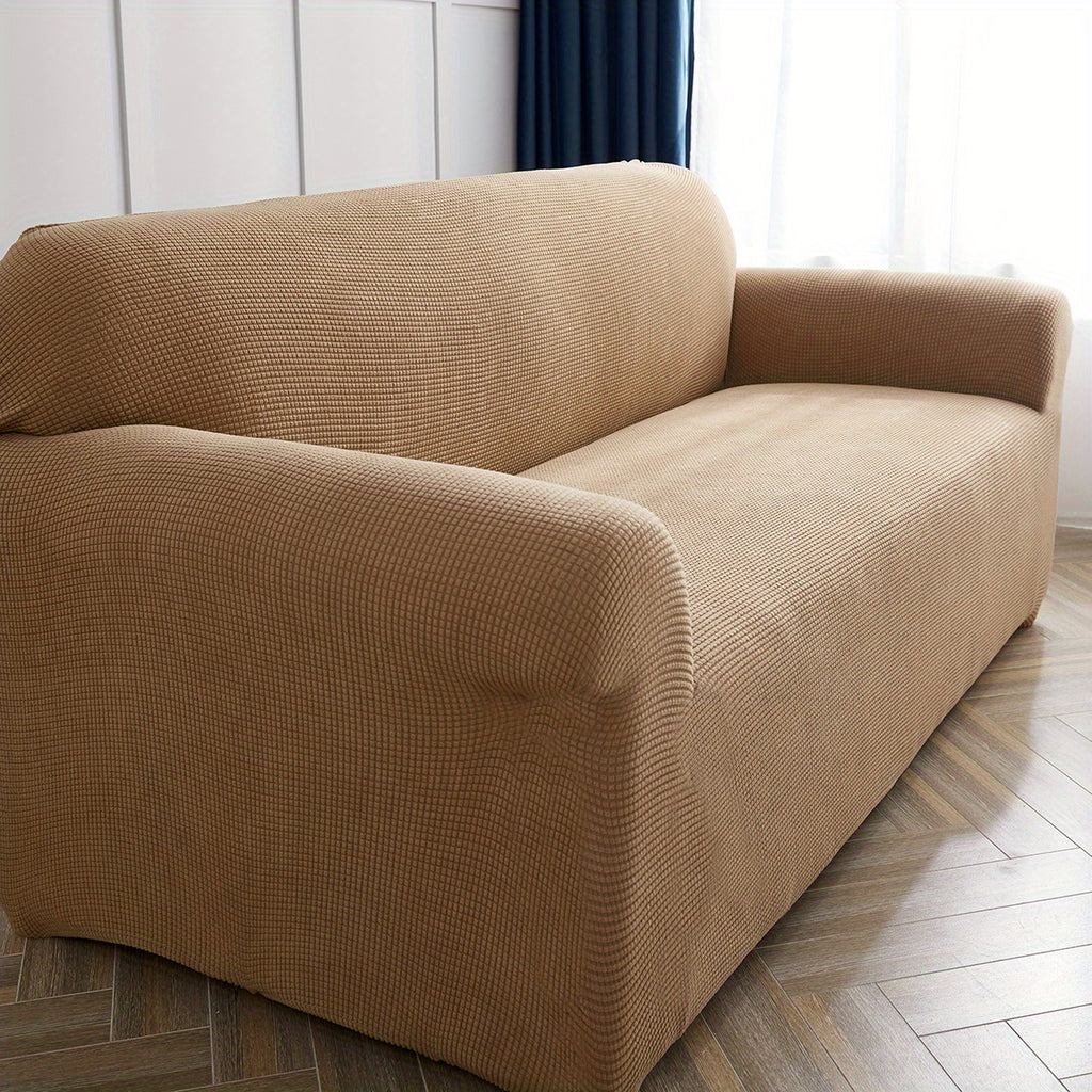 Calma sofa cover in Khaki 1, closer view of the seat, arm and back