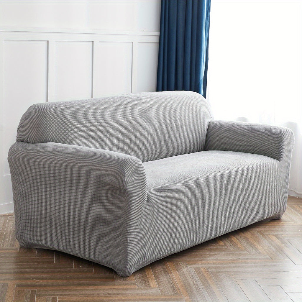 Calma sofa cover in Light Gray, angled view of the fitted shape