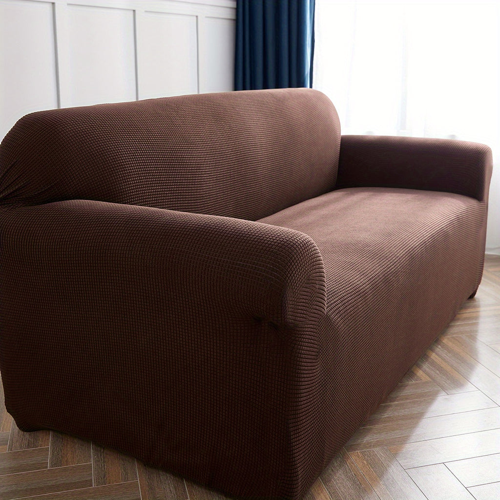 Calma sofa cover in Dark Coffee, closer view of the seat, arm and back