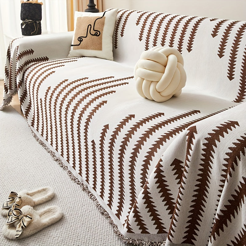 Rich Coffee Florence throw with brown zigzag stripes on a cream background, draped over a sofa