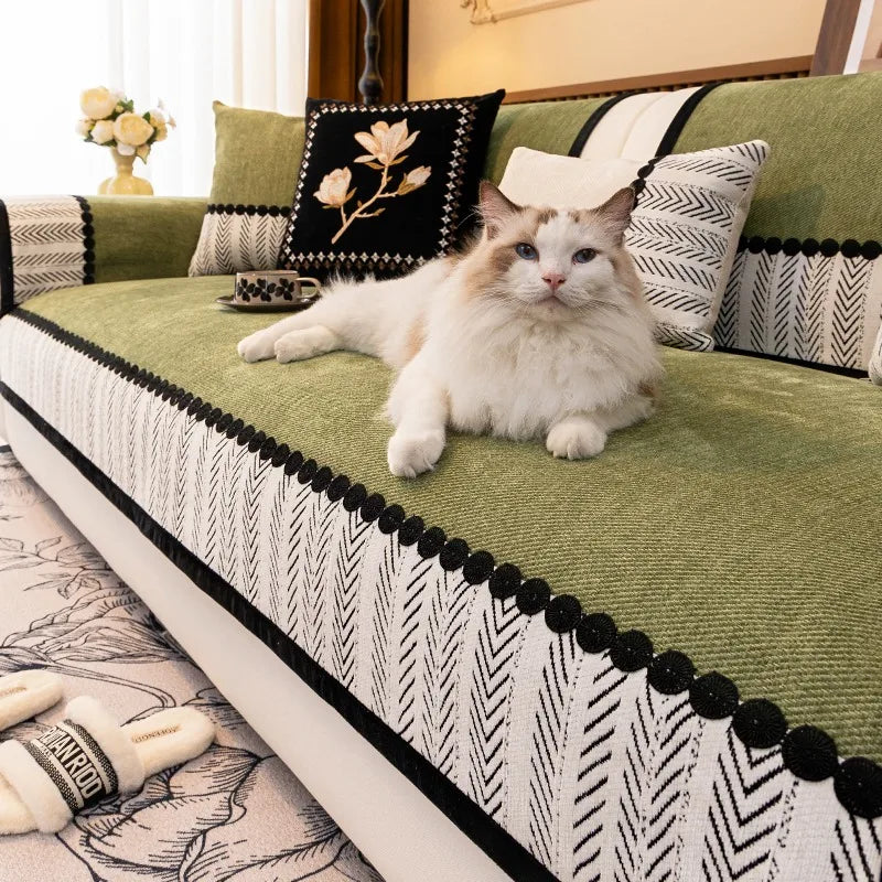 Cat on a green Marlow sofa panel with a black-and-white border.
