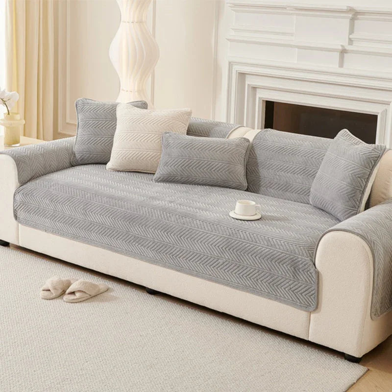Umbria grey chevron-pattern cover pieces arranged on a sofa