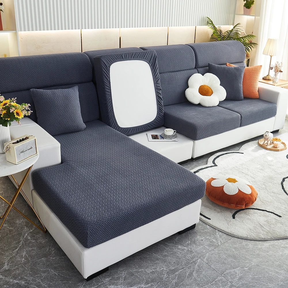 Navy Milan cushion covers arranged on a sofa