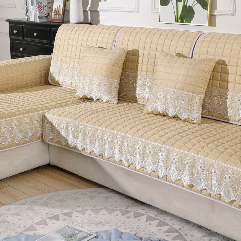 Beige Willow panels with quilted squares and pale lace trim on a sofa.
