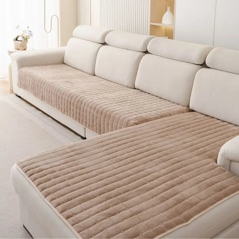 Light brown Velluto cover pieces across the seat and chaise of a cream sofa