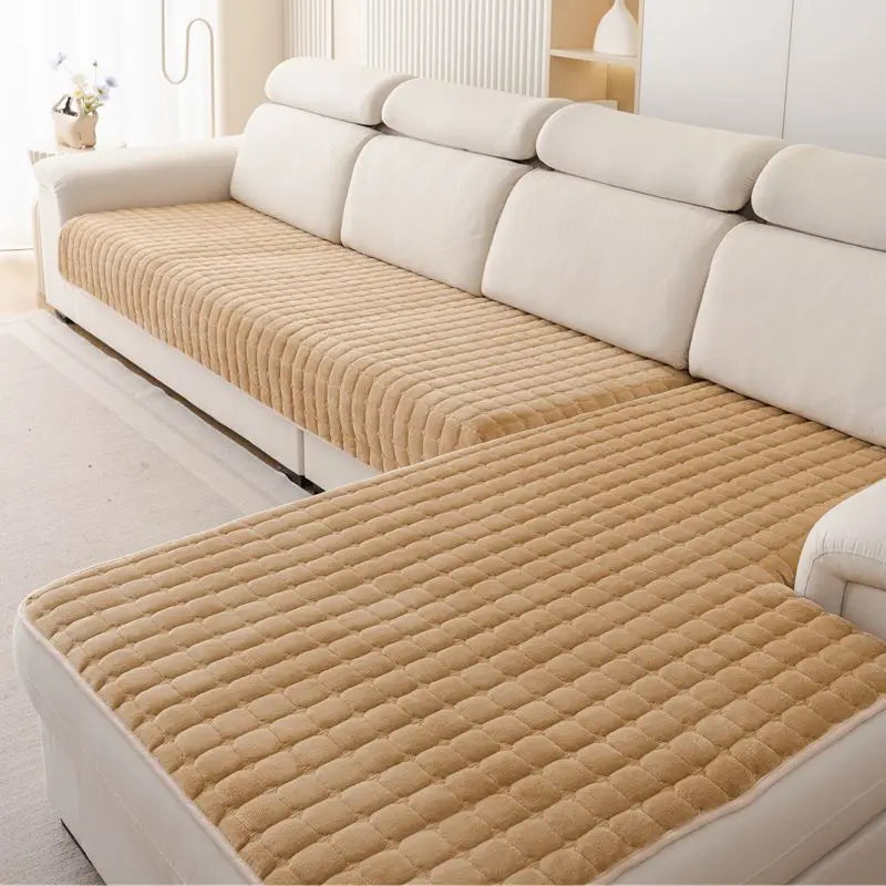 Tan Velluto cover pieces with a raised square pattern on a cream corner sofa