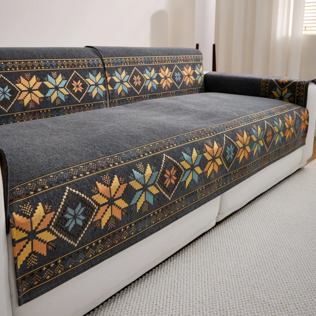 Angled view of Dark Grey Sorrento cover pieces on a white sofa