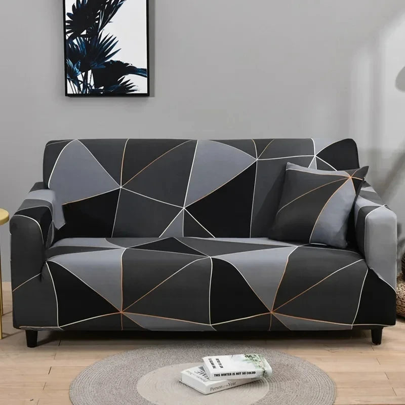 Sofa fitted with Celeste Color 02 cover showing black and grey polygons with fine contrasting lines