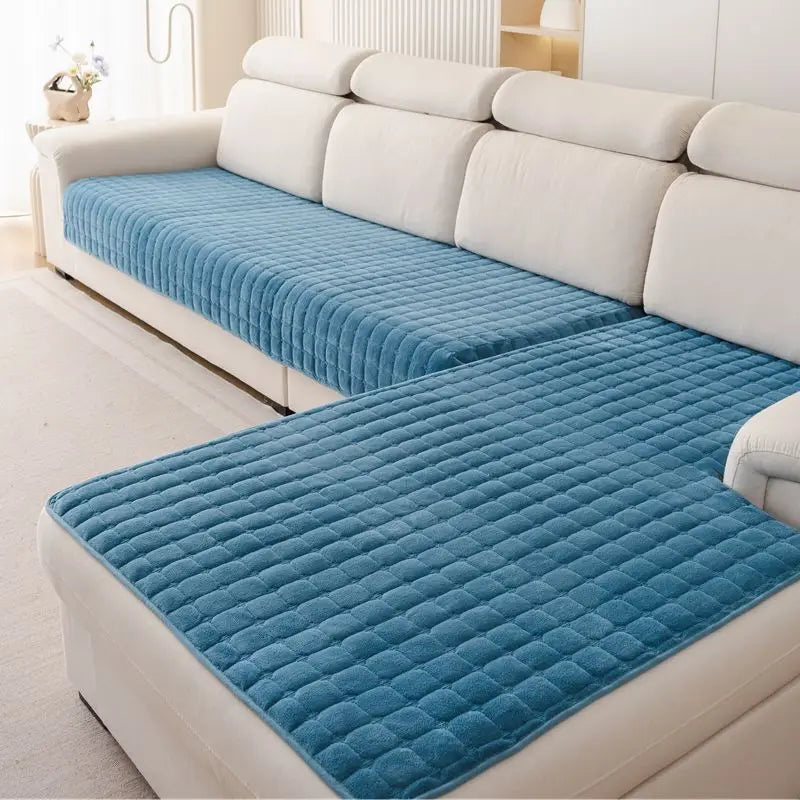 Blue Velluto cover pieces with a raised square pattern on a cream corner sofa