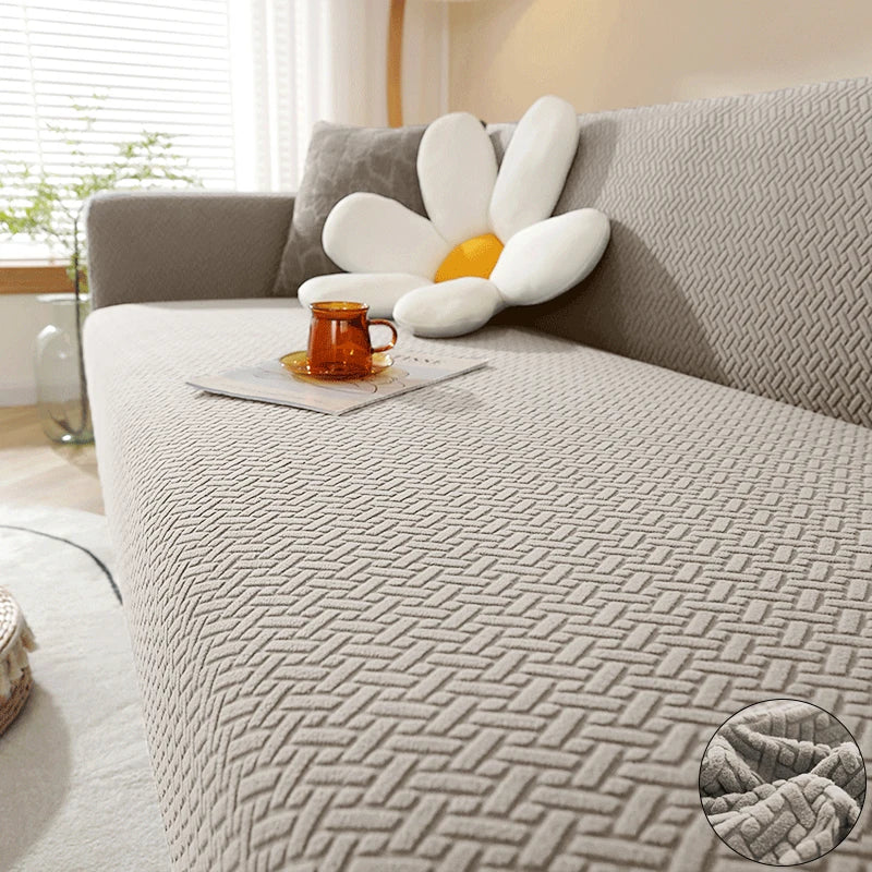 Taupe Verona Geometric cover across a sofa seat, backrest and arm, with raised interlocking texture