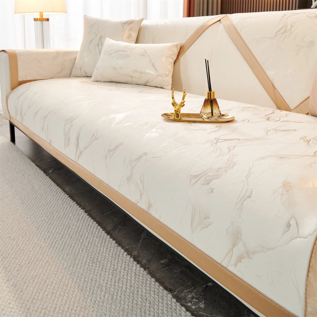 White Noira marble-pattern panels laid across a sofa seat and back, with a tray on the seat