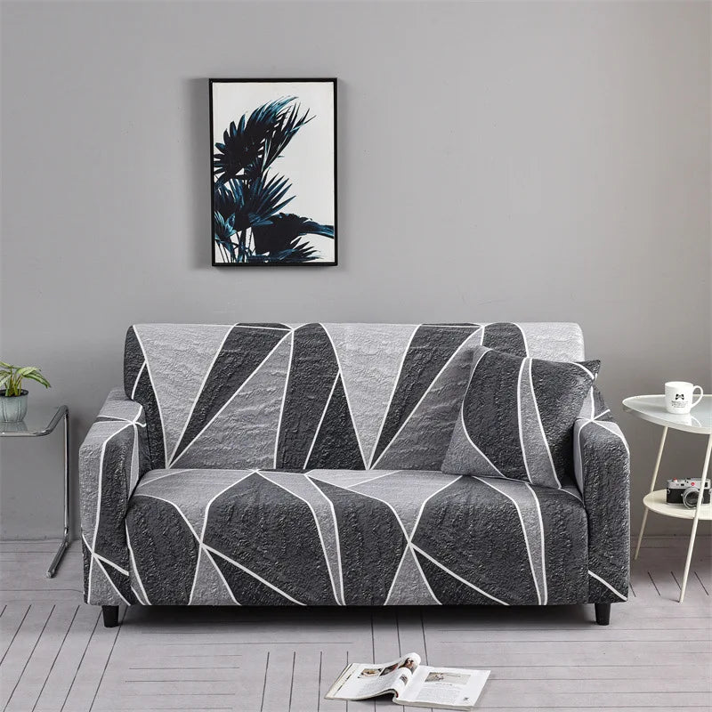 Sofa fitted with Celeste Color 19 cover showing grey and black sweeping geometric shapes