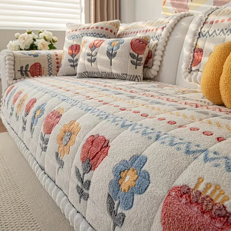 Bellini floral sofa pad draped over a seat, with coordinating pieces on the arm and back