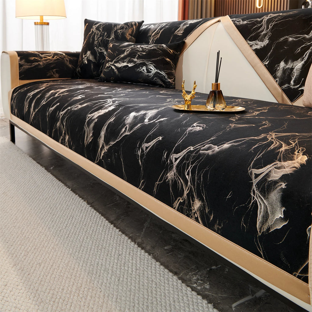 Black Noira marble-pattern panels laid across a sofa seat and back, with a tray on the seat