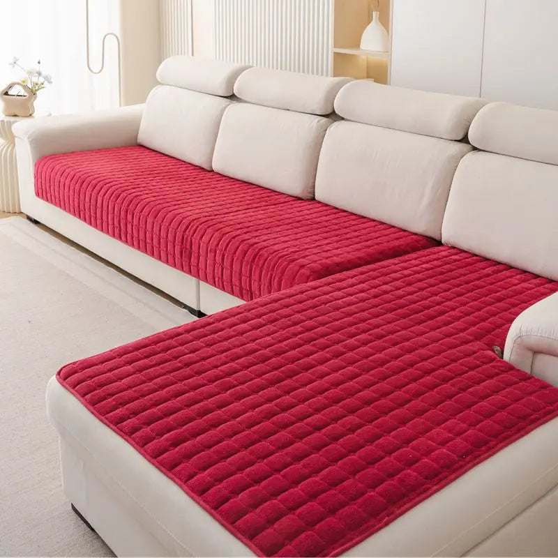 Red Velluto cover pieces with a raised square pattern on a cream corner sofa