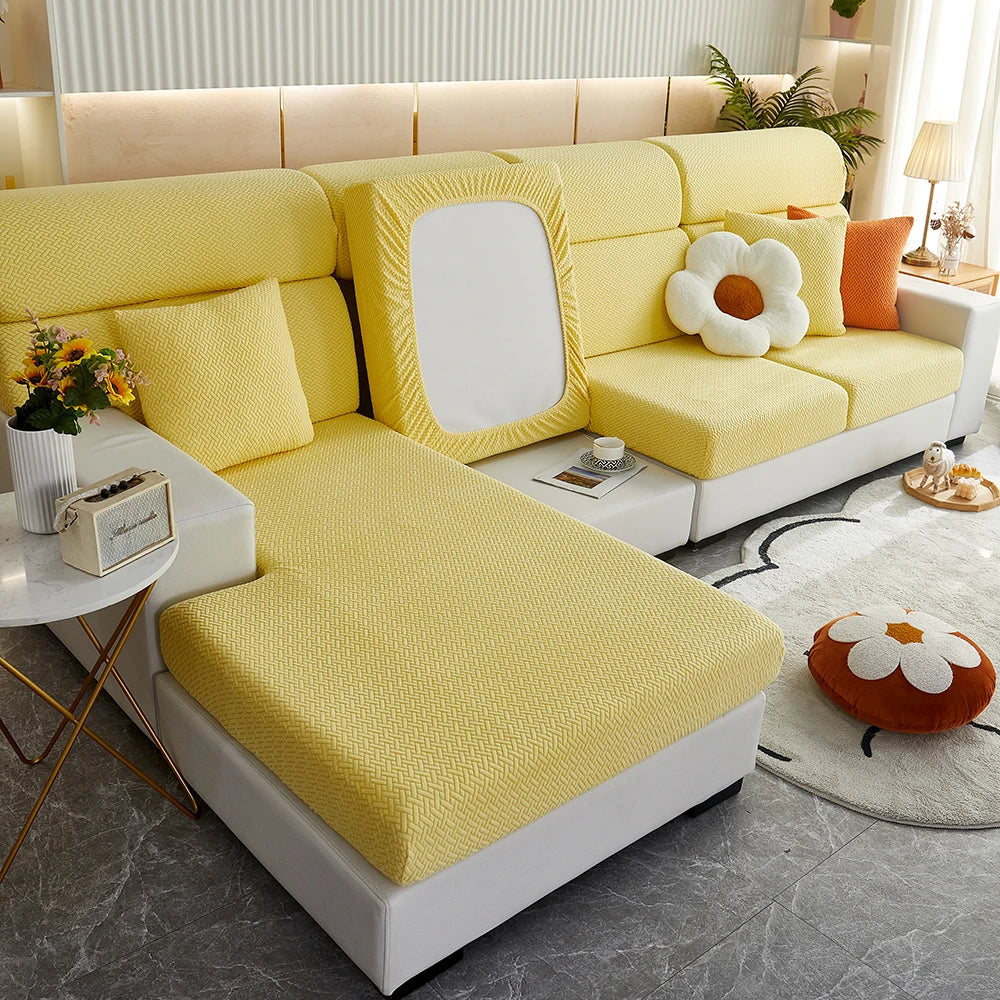Yellow Milan cushion covers arranged on a sofa