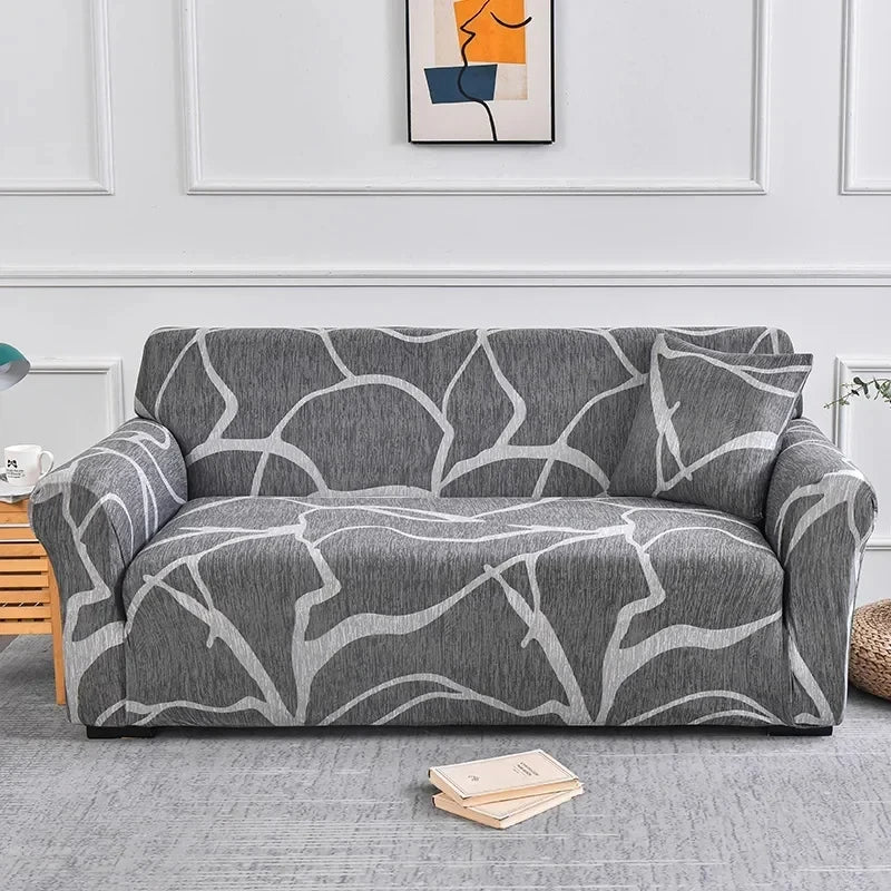 Sofa fitted with Celeste Color 12 cover showing large pale irregular outlines on dark grey