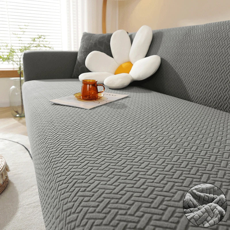 Grey Verona Geometric cover across a sofa seat, backrest and arm, with raised interlocking texture