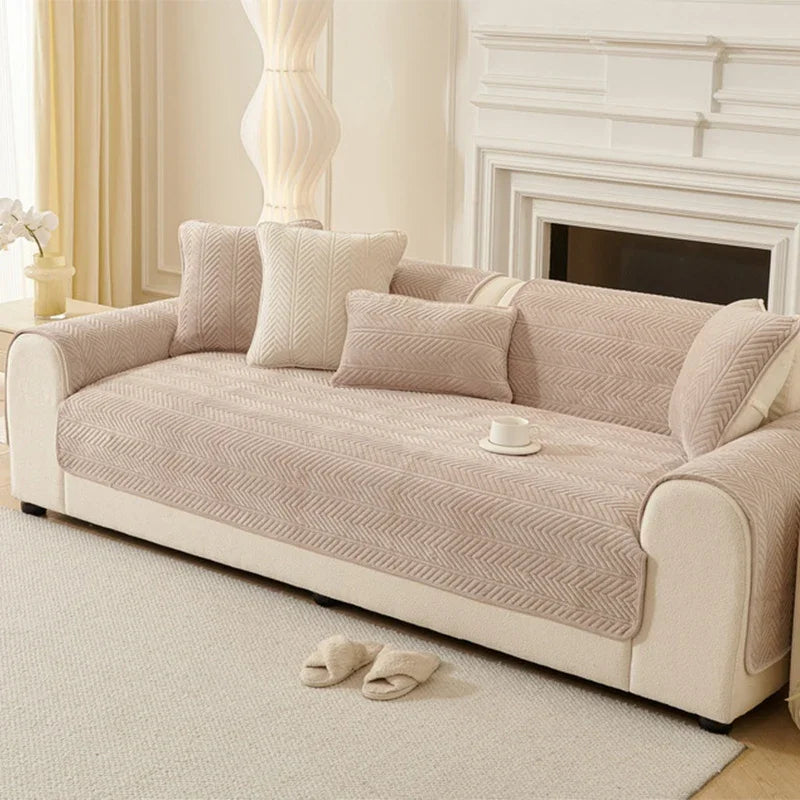 Umbria warm beige chevron-pattern cover pieces arranged on a sofa