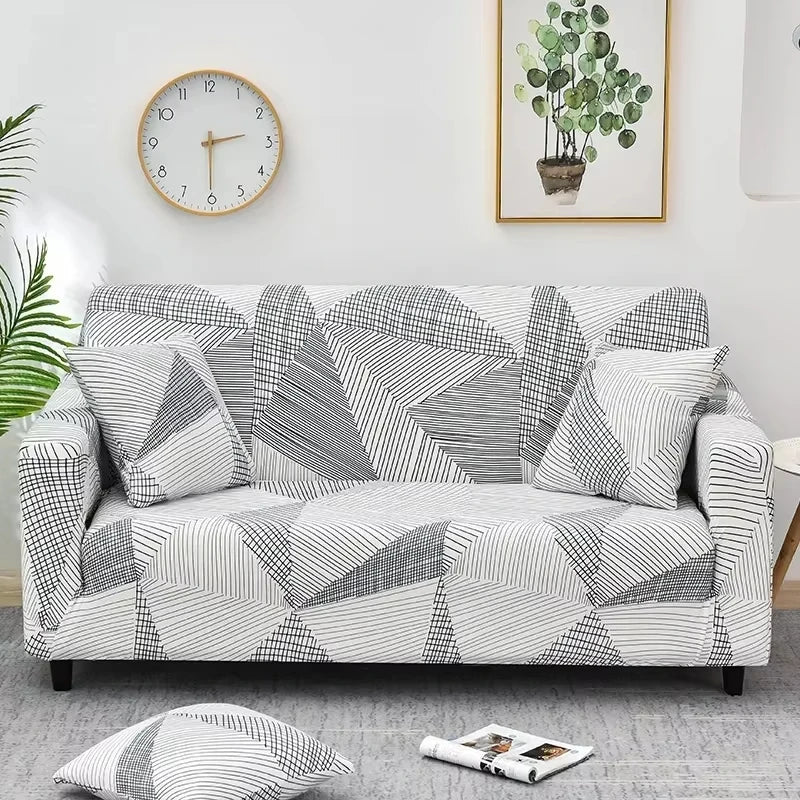 Sofa fitted with Celeste Color 16 cover showing grey outlined leaf-like shapes on white