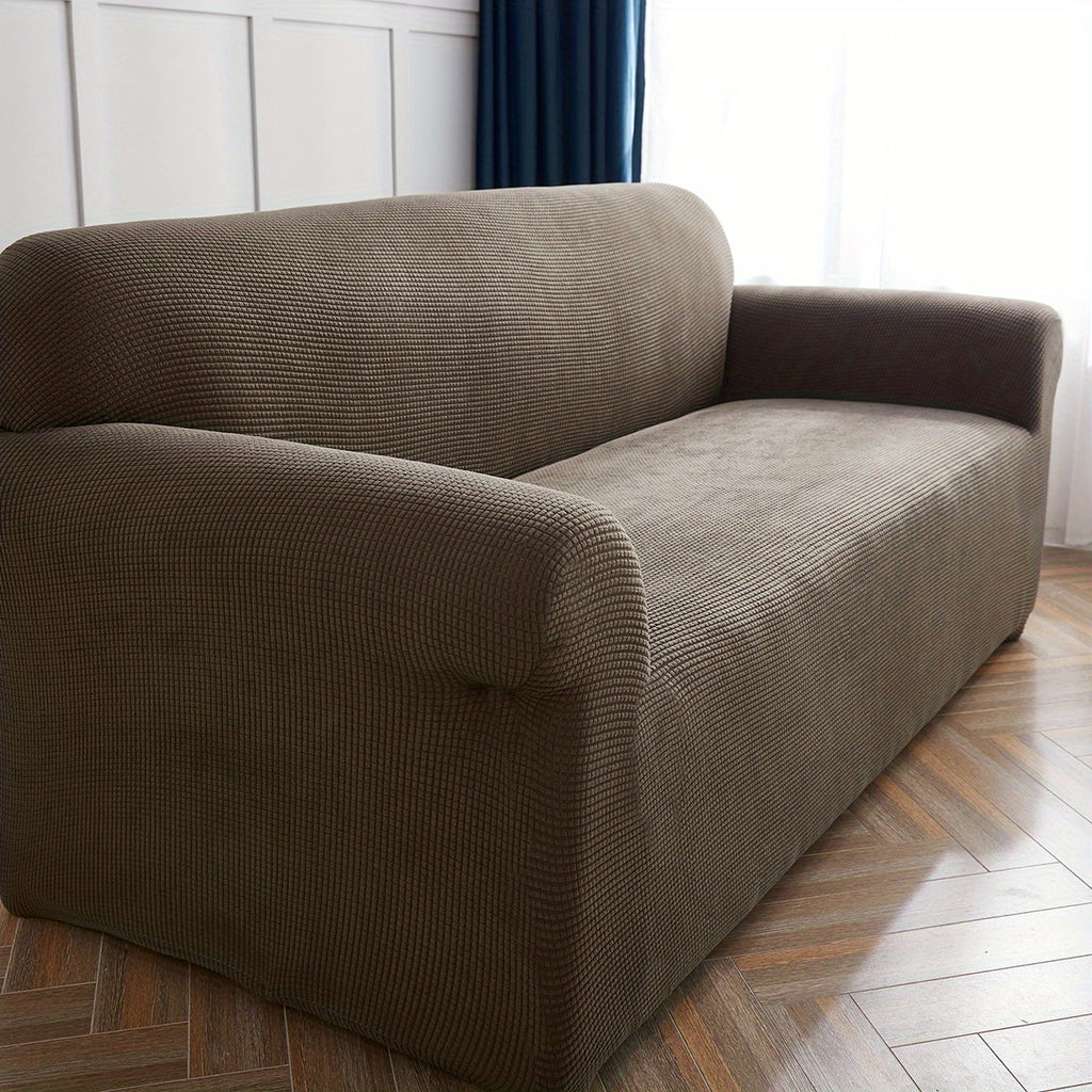 Calma sofa cover in Light Coffee, closer view of the seat, arm and back
