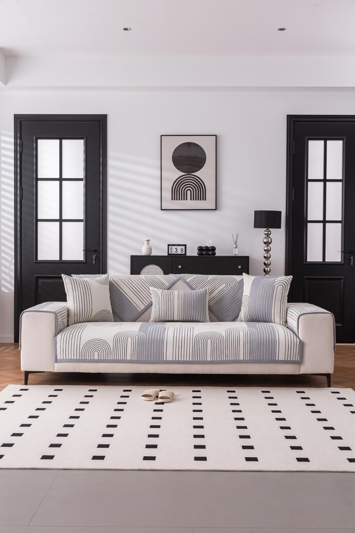 Sofa Decor Arcadia Arch Line Sofa Cover in Black Cream - styled sofa image for water resistant patterned couch covers in Australia