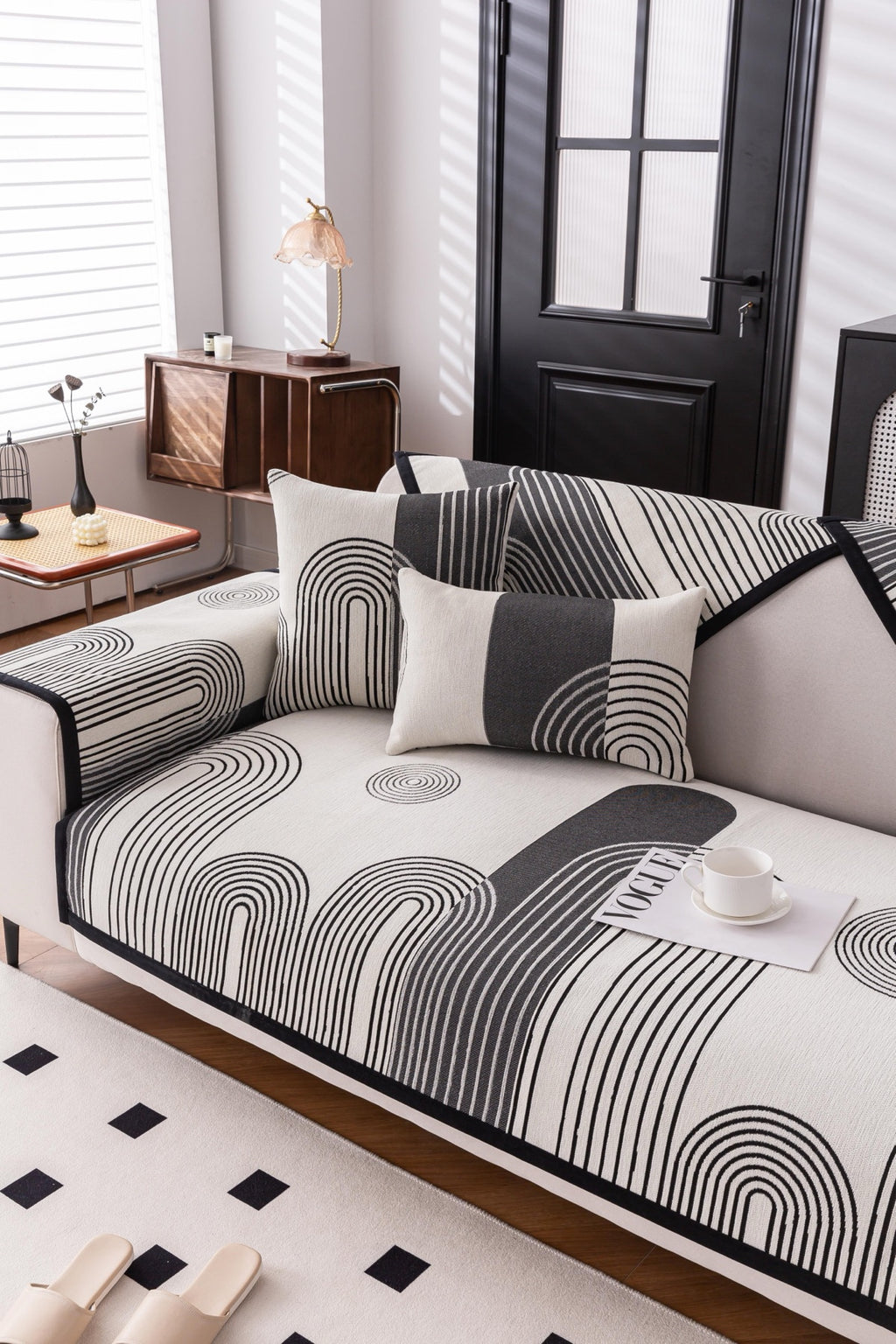 Sofa Decor Arcadia Arch Line Sofa Cover in Black Cream - styled sofa image for water resistant patterned couch covers in Australia