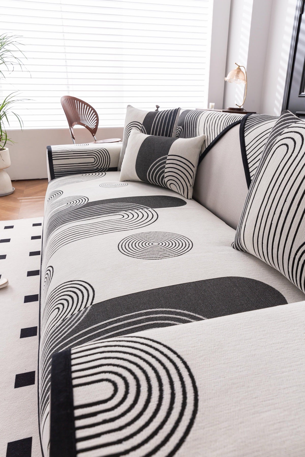 Sofa Decor Arcadia Arch Line Sofa Cover in Black Cream - styled sofa image for water resistant patterned couch covers in Australia