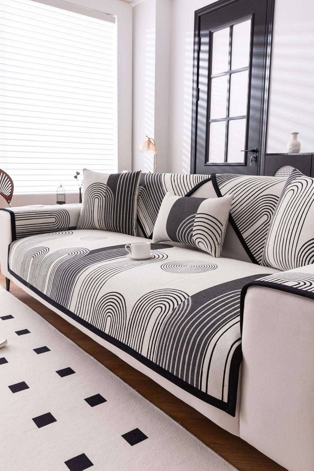 Sofa Decor Arcadia Arch Line Sofa Cover in Black Cream - styled sofa image for water resistant patterned couch covers in Australia