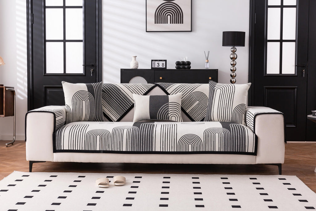Sofa Decor Arcadia Arch Line Sofa Cover in Black Cream - styled sofa image for water resistant patterned couch covers in Australia