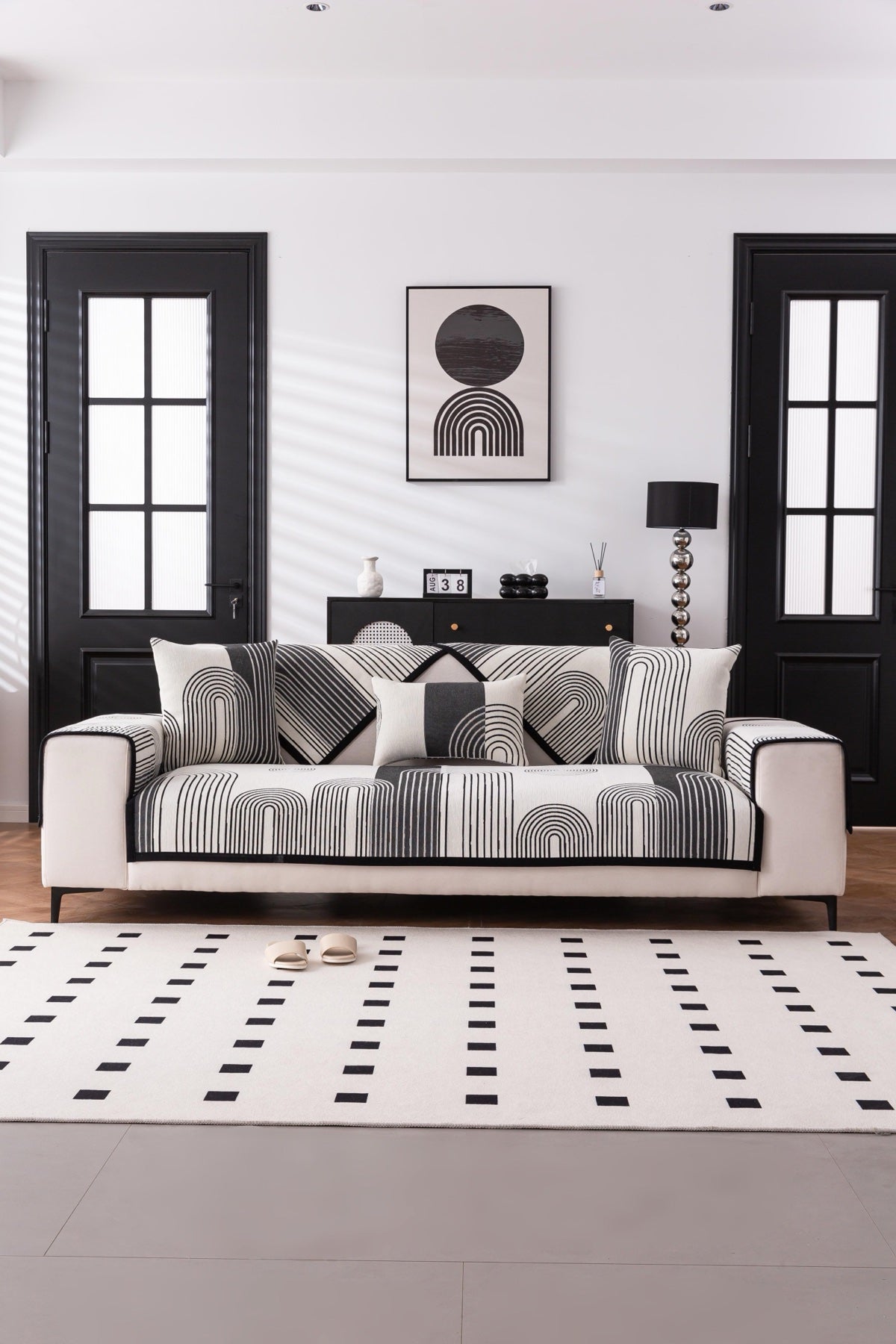 Sofa Decor Arcadia Arch Line Sofa Cover in Black Cream - styled sofa image for water resistant patterned couch covers in Australia