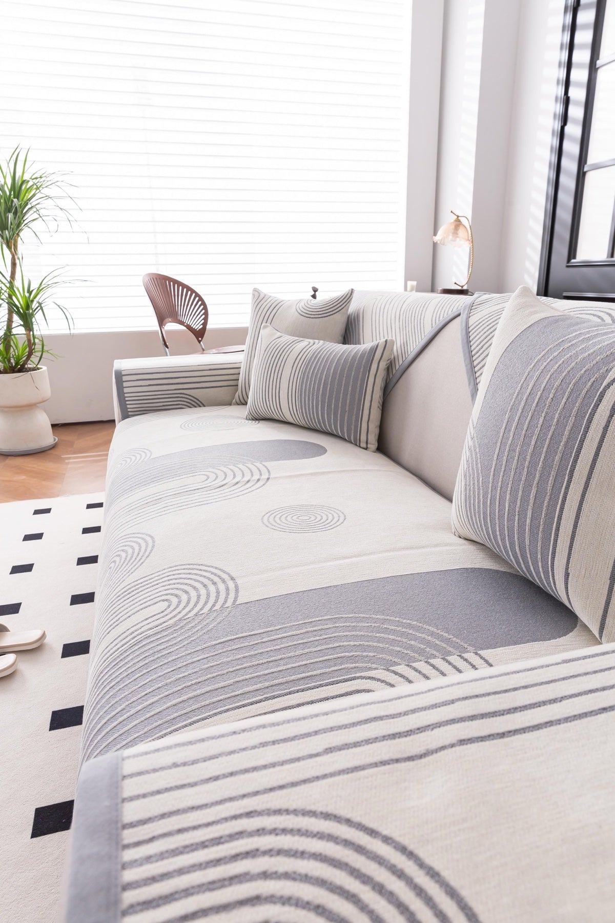 Sofa Decor Arcadia Arch Line Sofa Cover in Silver Grey - styled sofa image for water resistant patterned couch covers in Australia