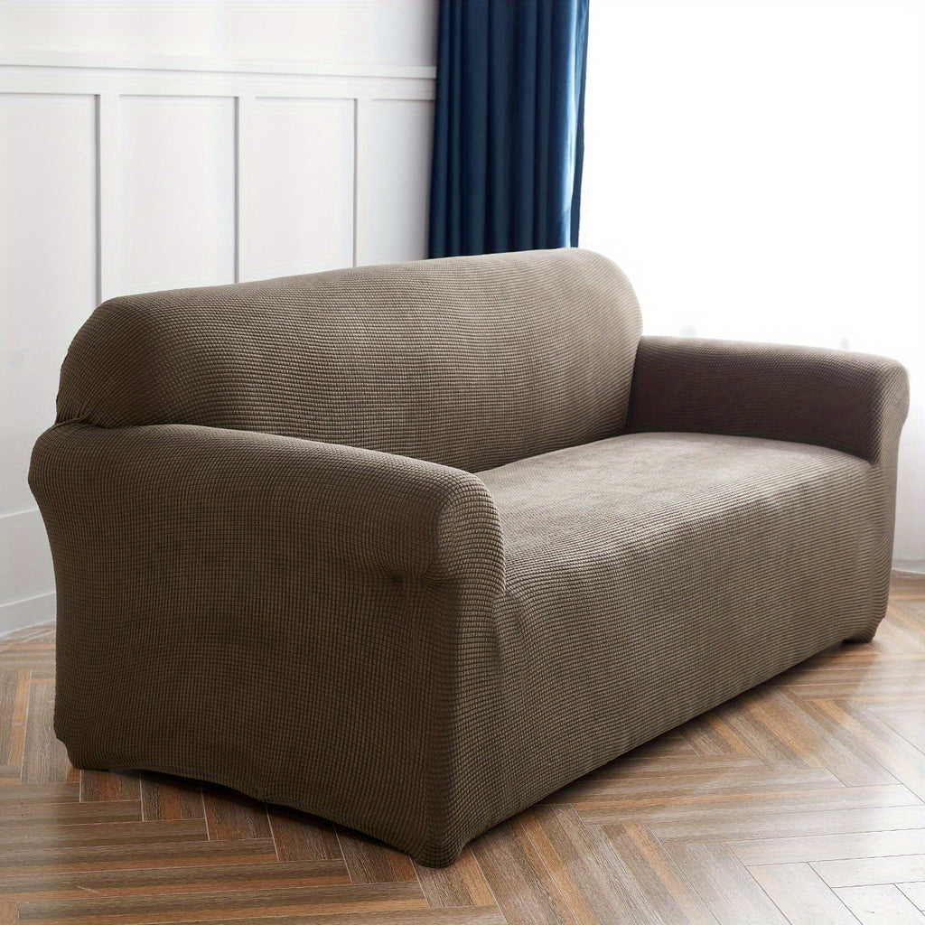 Calma sofa cover in Light Coffee, angled view of the fitted shape
