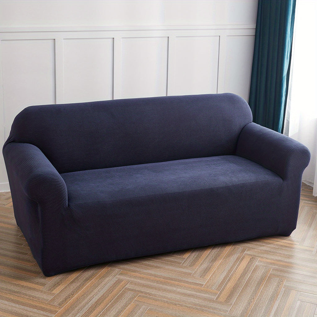 Calma sofa cover in navy blue, wide view over the seat and arms
