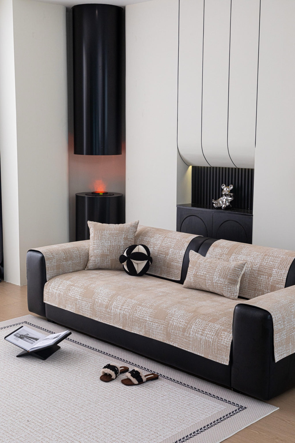 Wide view of a sofa with warm beige Hampton plaid pieces and matching cushions
