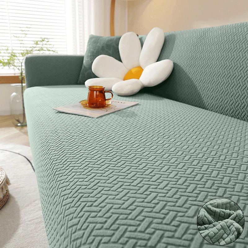 Jacquard elastic sofa cover in matcha green with geometric knit texture on modern living room sofa