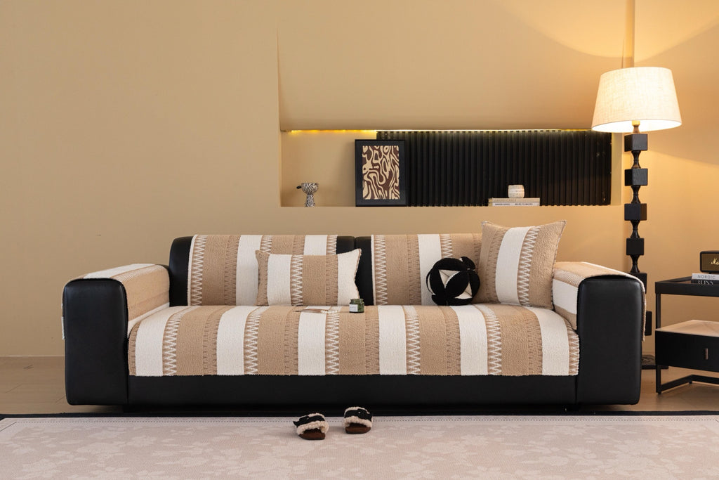 Front view of a sofa arranged with sand beige and cream Marlow stripes