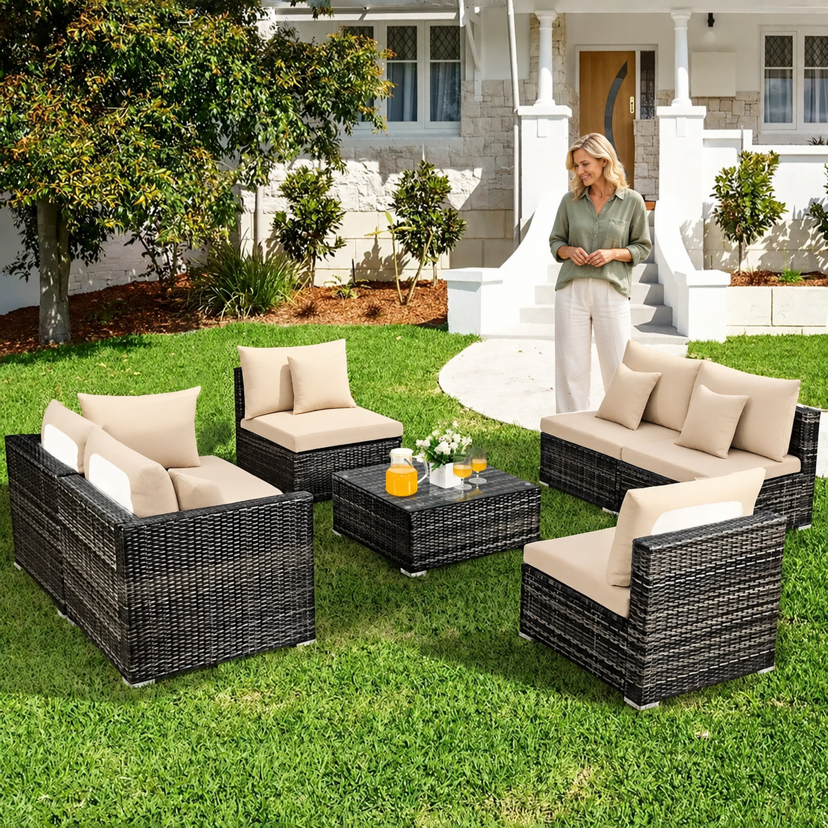 Sofa Decor Palm Cove Tropical Outdoor Cushion Covers in Beige, styled with a blonde woman.