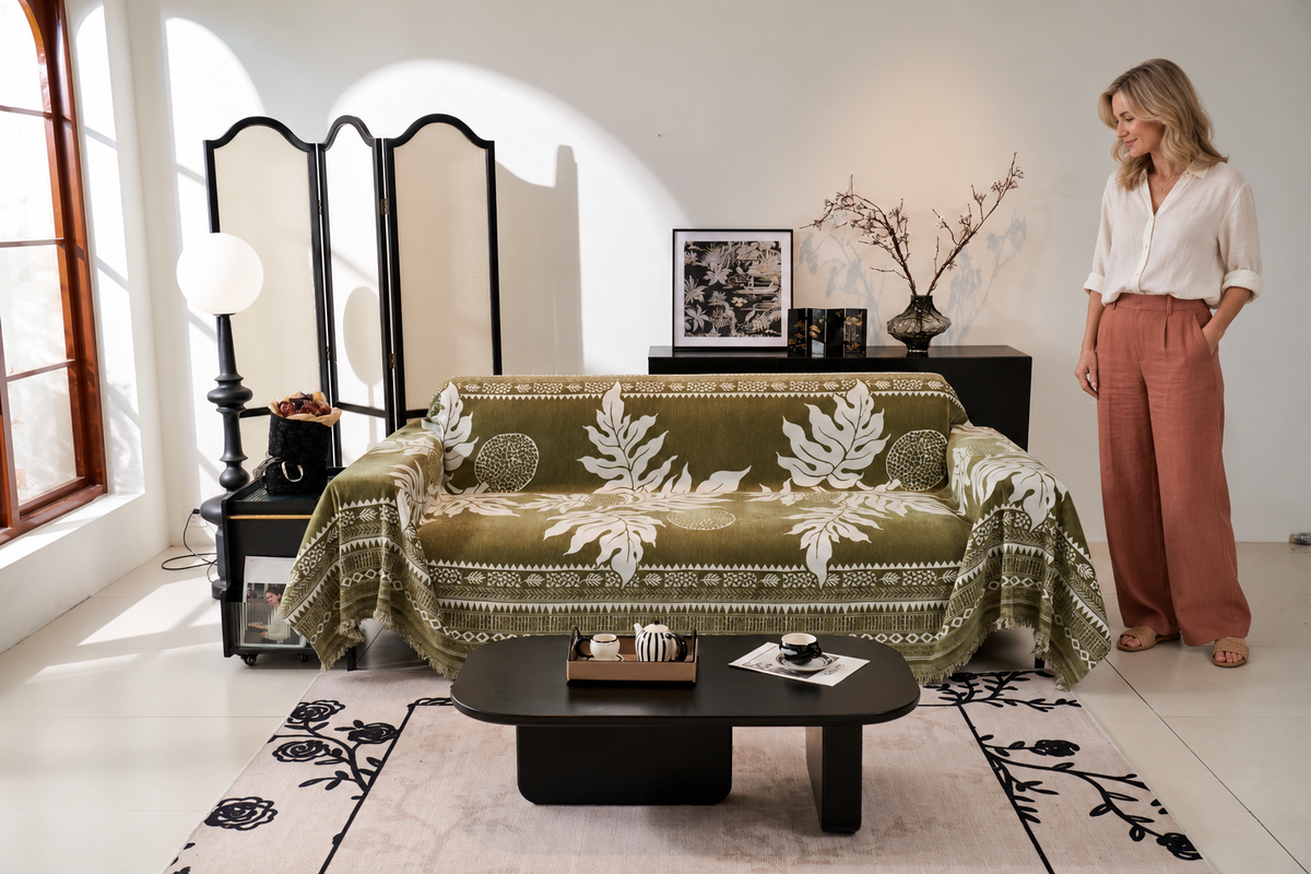 Sofa Decor Amalfi Palm Jacquard Sofa Throw Cover in Olive Palm, styled with a blonde woman.