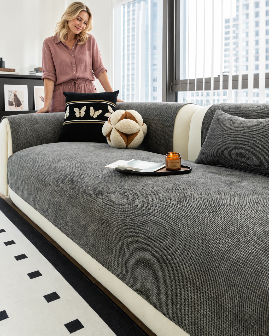 Sofa Decor Oslo Minimal Jacquard Sofa Cover in Dark Grey, styled with a blonde woman.