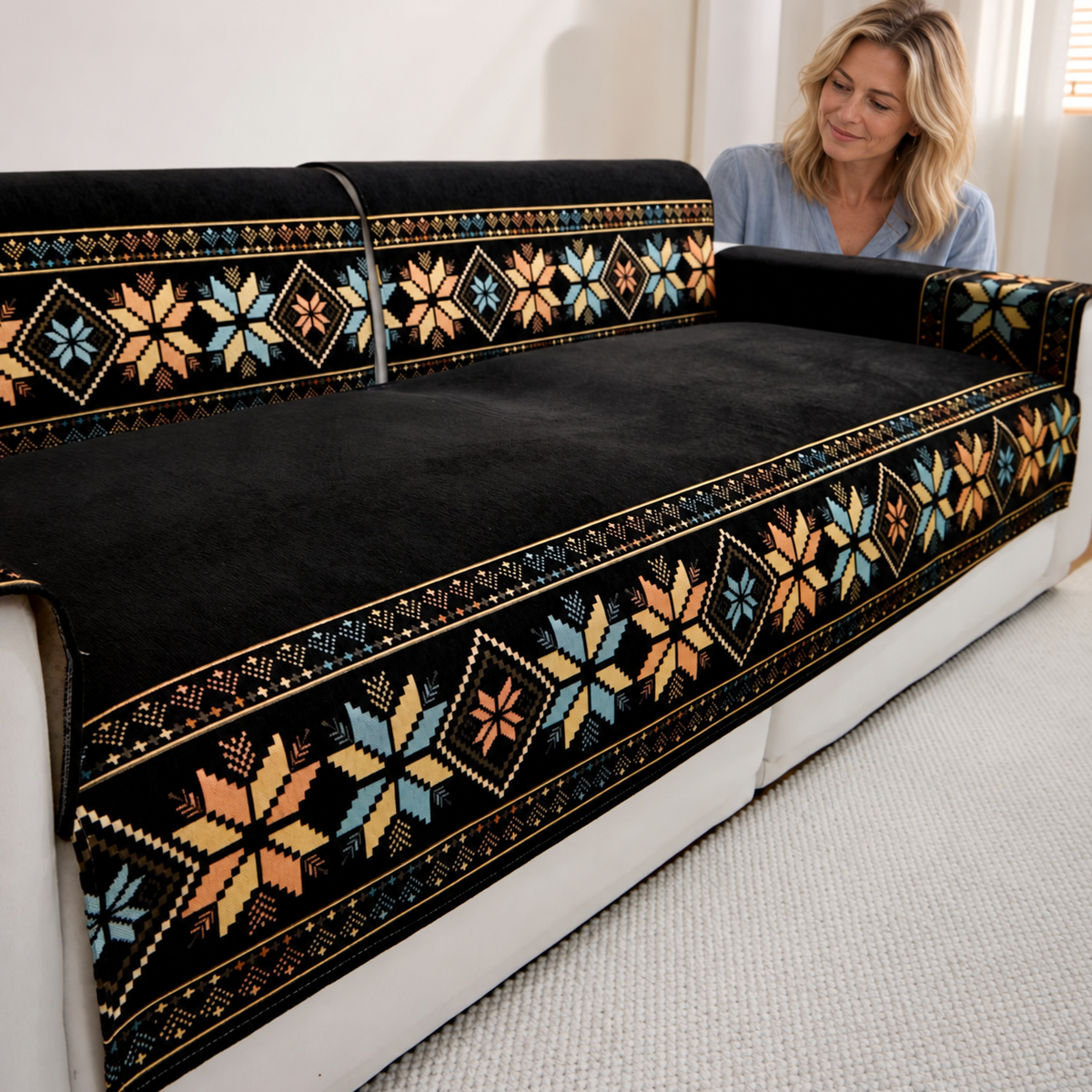 Sofa Decor Sorrento Jacquard Chenille Sofa Cover in Black, styled with a blonde woman.