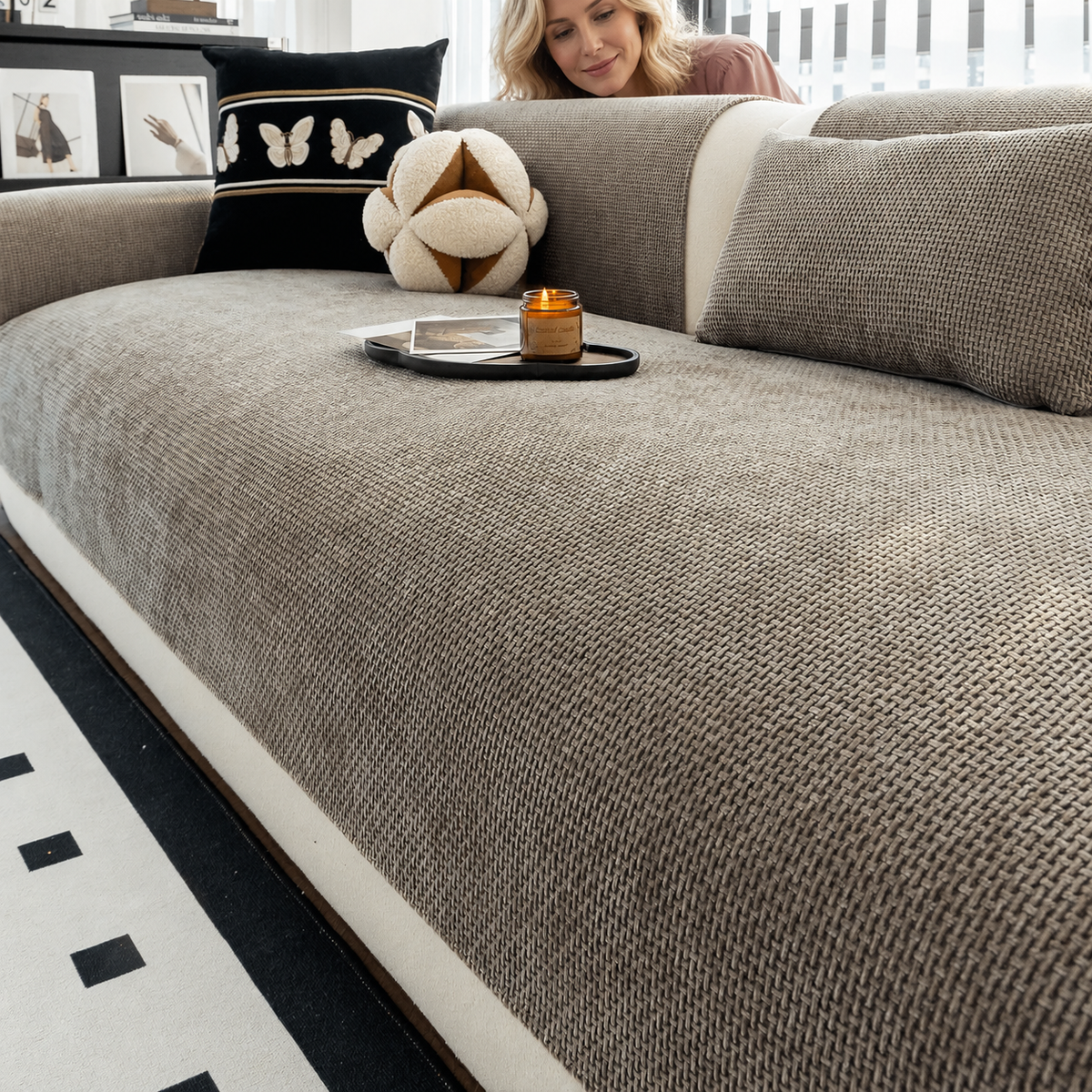 Sofa Decor Oslo Minimal Jacquard Sofa Cover in Grey, styled with a blonde woman.