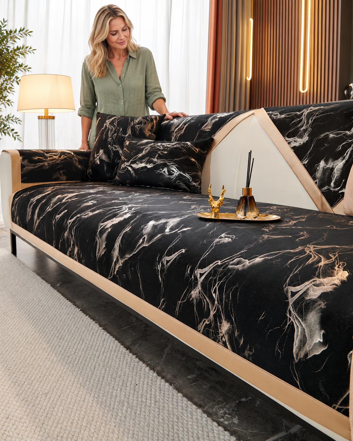 Sofa Decor Noira Marble Velvet Sofa Cover in Black, styled with a blonde woman.