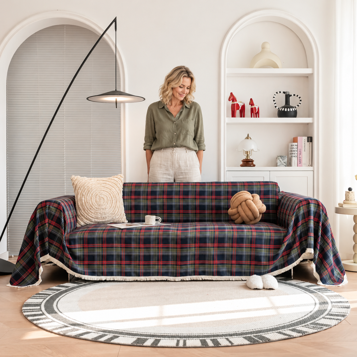 Sofa Decor Harper Plaid Sofa Cover in blue plaid, styled with a blonde woman.