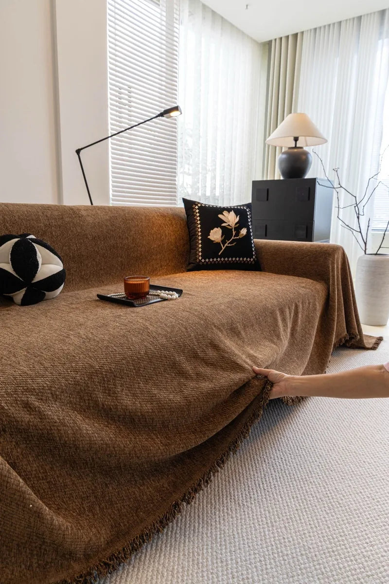 Cocoa Brown Milano ribbed sofa throw draped across a sofa with a fringed front edge